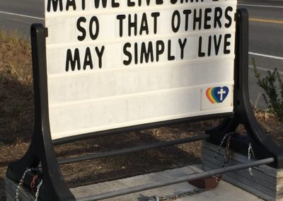 sign at Saint Peter's Lutheran church may we live simply so that others may simply live